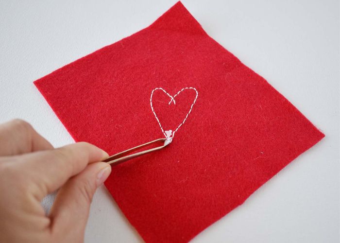 Use tweezers to collect the smallest pieces