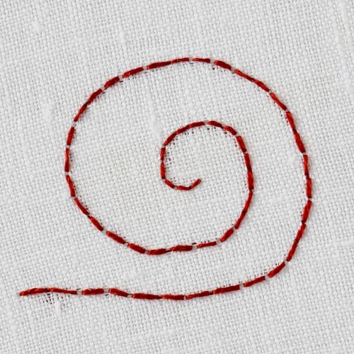 how to embroider back stitch: circle in dark red thread on white fabric;  Back stitch embroidery tutorial example 2 image; BackStitch example 2 image; how to do Back stitch example 2 image; how to embroidery Back stitch example 2 image; Back stitch embroidery example 2 image; back stitch hand embroidery; back stitch tutorial; back stitch embroidery tutorial