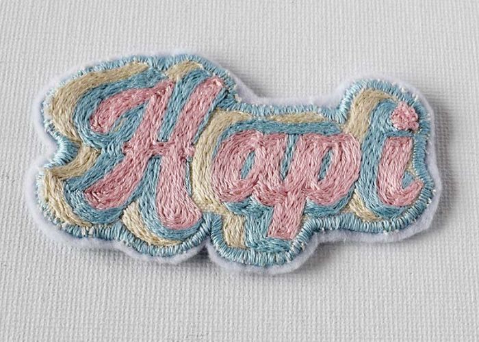 how to embroider decorative mending:  patch with retro lettering