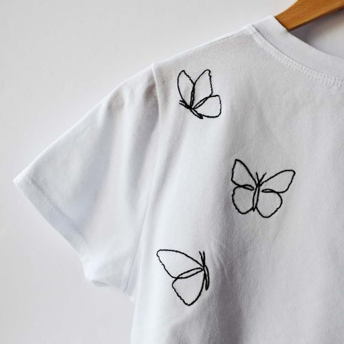 Hand embroidery for mending: Butterfly embroidery on a t-shirt
