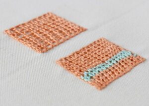 Ceylon Stitch embroidery with orange pearl cotton;  Ceylon Stitch how to example; how to do a Ceylon Stitch; example how to make Ceylon Stitch example; step-by-step Ceylon Stitch example