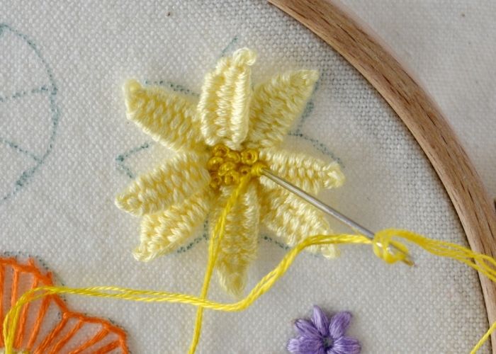 Detached Woven Picot flower with French knots in the center